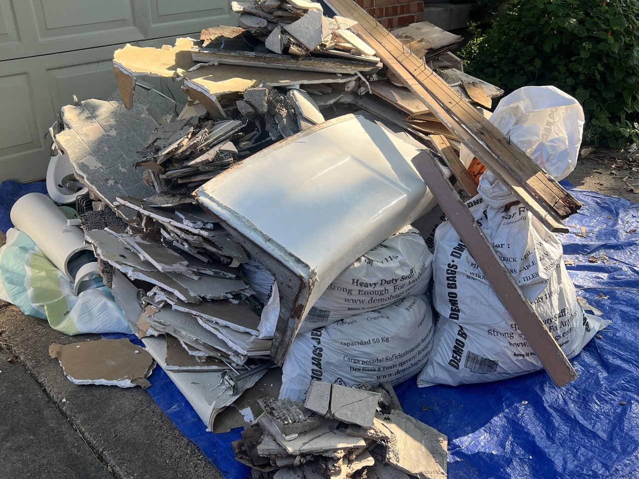 Texas Junk Boyz dump trailer loaded with construction debris from a residential renovation