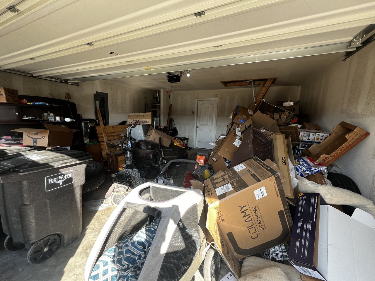 Stack of old TVs, monitors, and computer towers ready for electronics recycling pickup